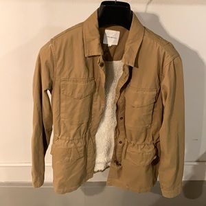 Camel colored field jacket. Faux fur lined interior